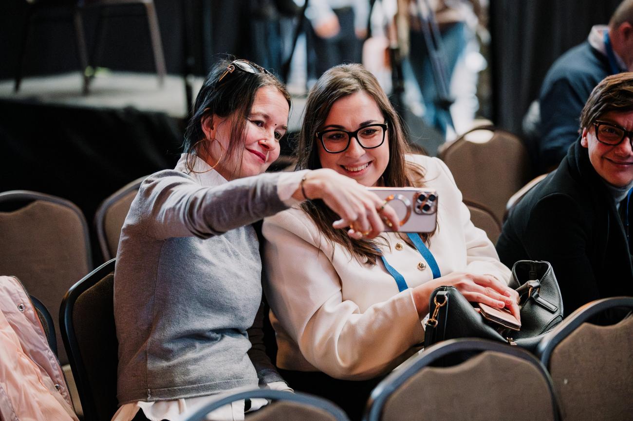 Two women take selfie at Europe, let's cooperate 2025 in Krakow