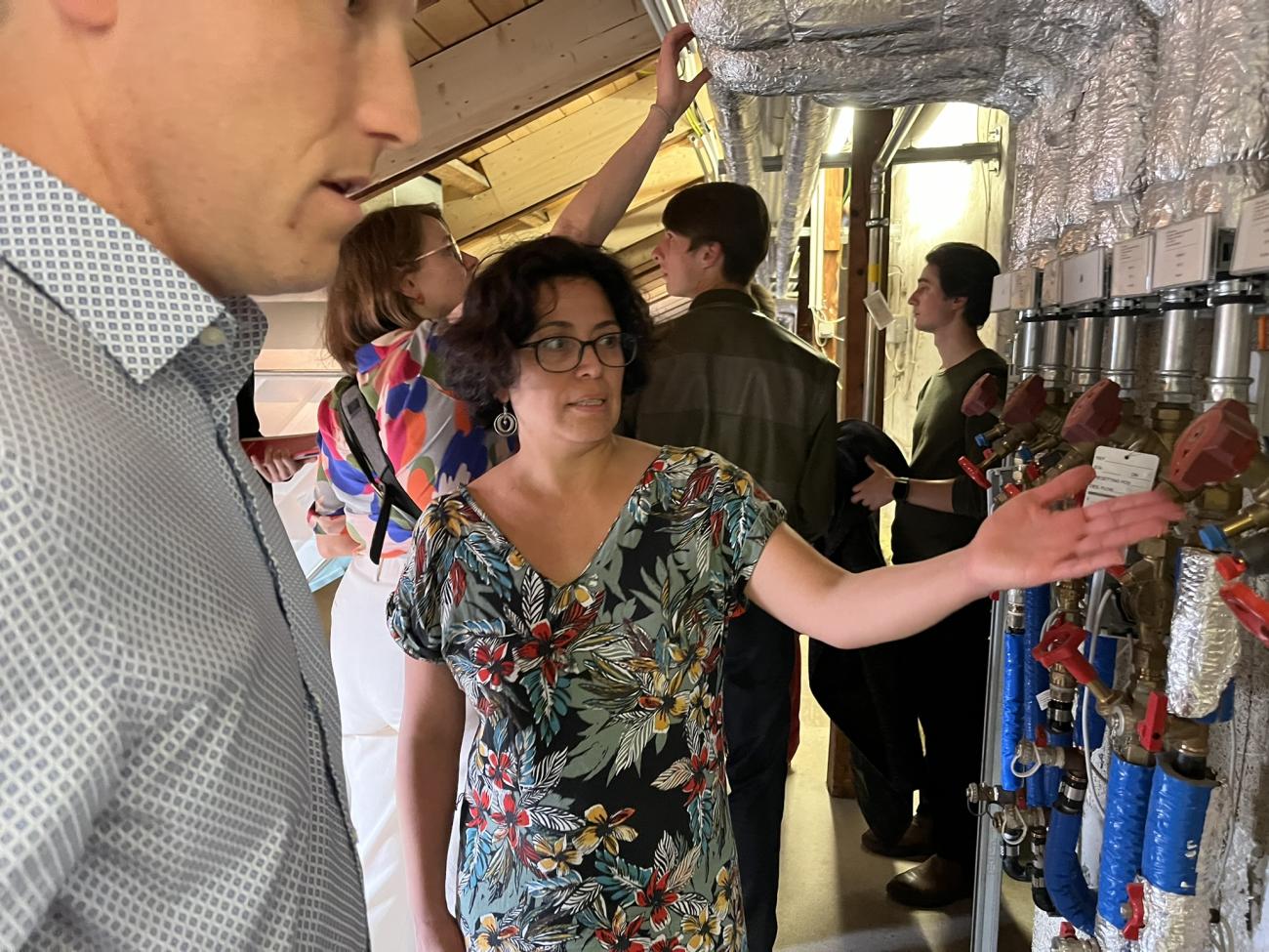 People looking at the heating device 