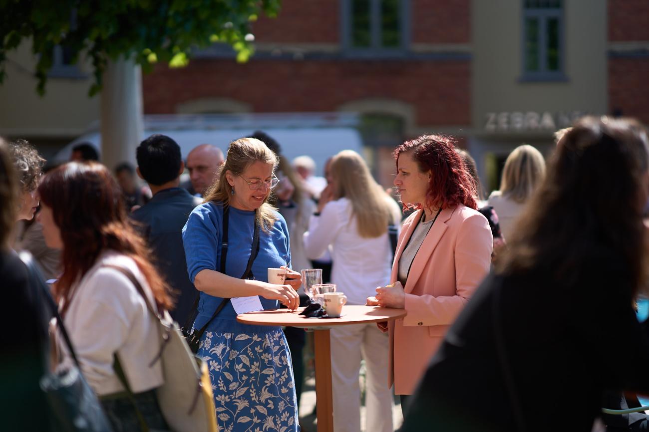 Women networking over high table