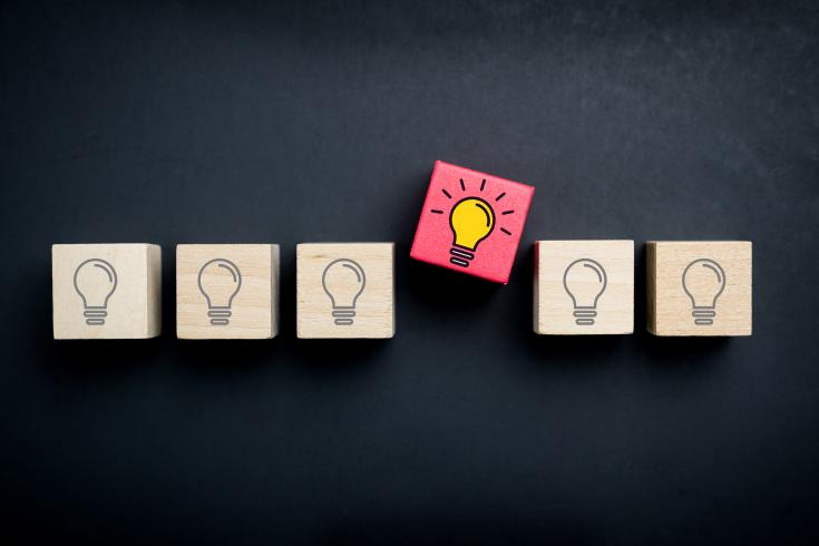 Wooden building blocks with lightbulb drawings