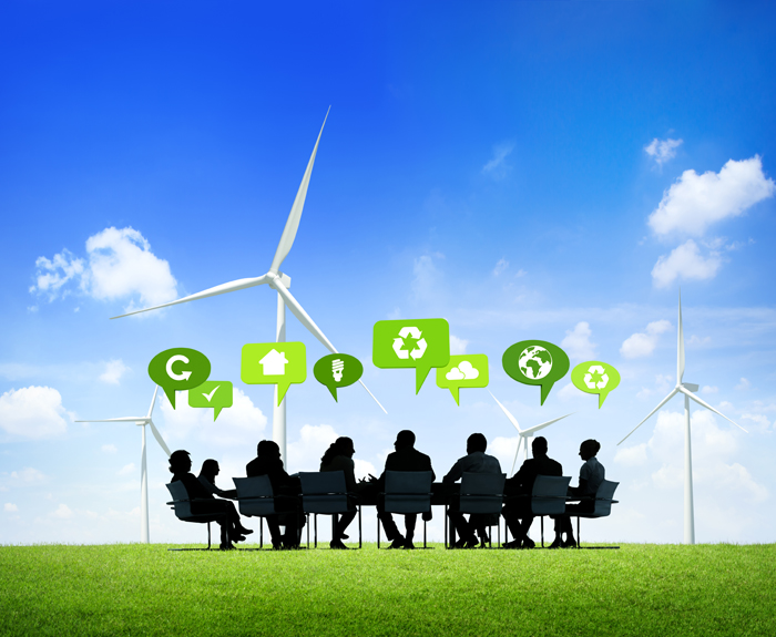 people around a table talking about sustainable matters (wind energy etc)
