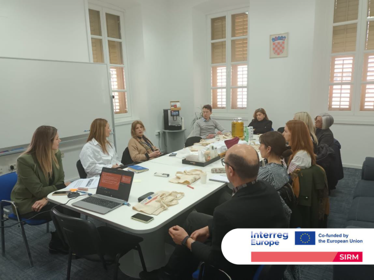 4th Regional Stakeholder Group Meeting - Sibenik, Croatia Meeting participants seated around a table. One person is in the middle of a speech.