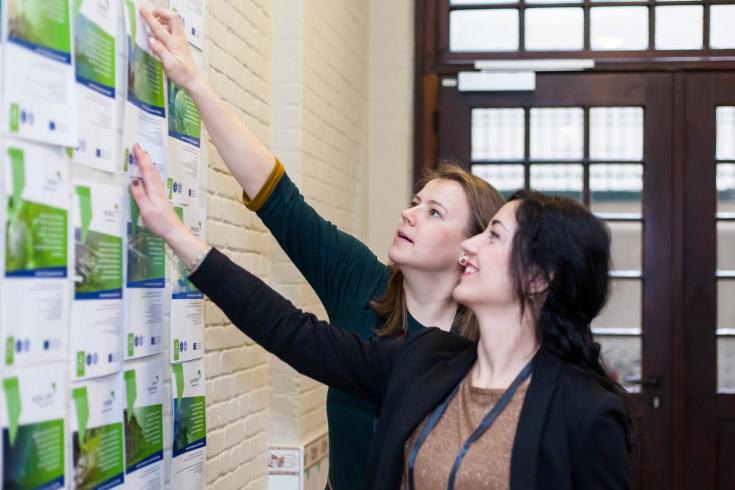 Two women looking at pamphlets Two women looking at pamphlets