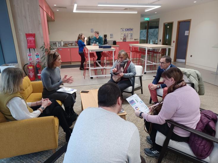 people sitting in a hub open area