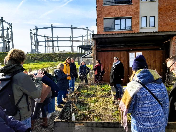 Ghent stakeholder meeting 2 People standing outside on a sunny but cold day looking at a greening project