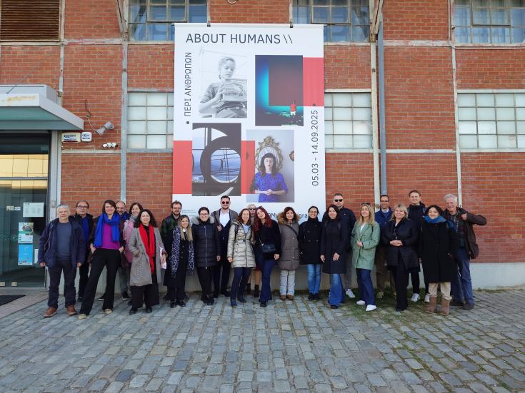 people posing infront of museum