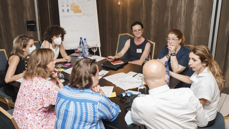 People around a table and working together