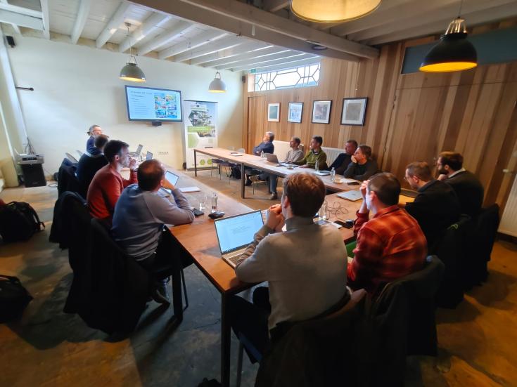 Group of people sitting in a conference room