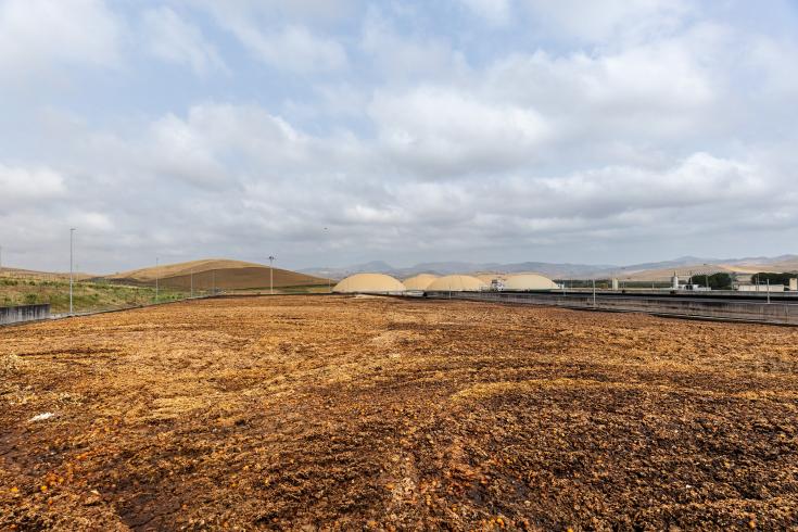 A Biomethane plant in Sicily, with citrus fruit waste in the foreground. 