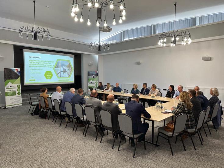 People around a meeting table having a conference