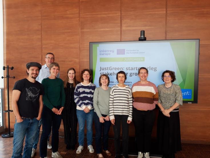 JUSTGREEN Local Stakeholder meeting - City of Ghent Group of people in front of JUSTGREEN EU Interreg screen