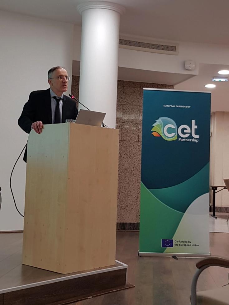 A man speaks to audience at CET Partnership event.
