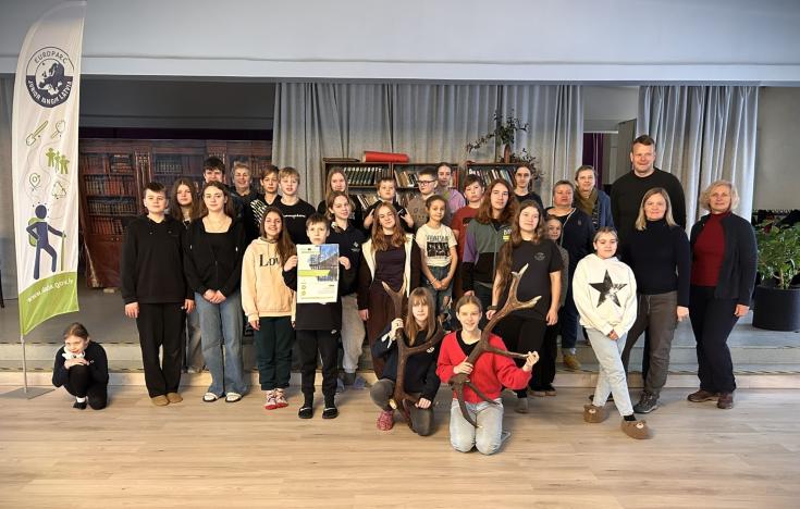 I see many people taking a group photo