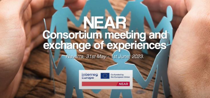 Paper people holding hands with encircling hands around them. Text: "NEAR - consortium meeting and exchange of experiences - 31st of May - 2nd of June
