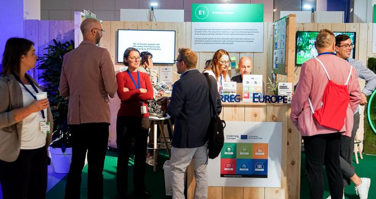 people at an exhibition stand