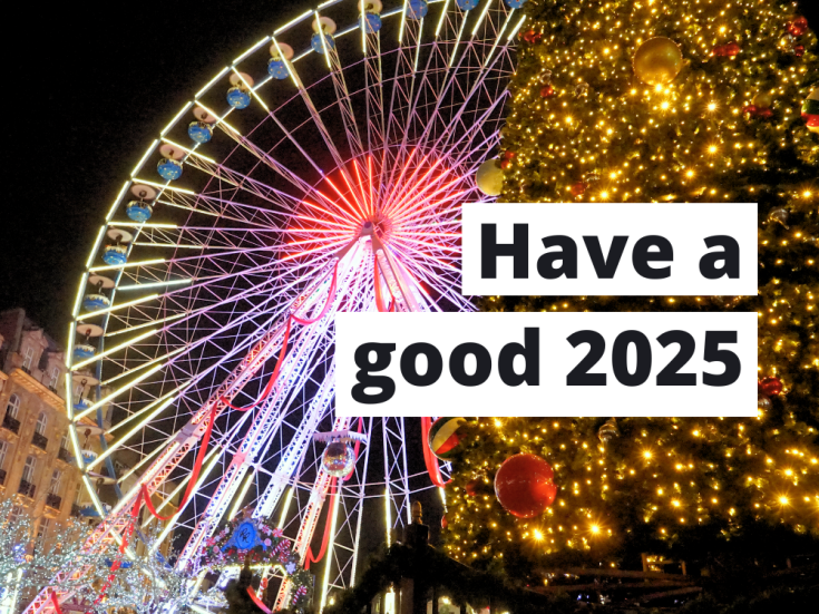 Best wishes for 2025 A festive scene featuring a brightly lit Ferris wheel and a large Christmas tree adorned with glowing lights and ornaments. Overlaid text reads, 'Have a good 2025.'