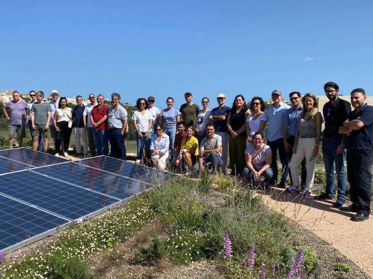 Group photo of the GEMS project team, including partners and stakeholders from various European regions, gathered during the transnational meeting in Malta, smiling and standing together outdoors.