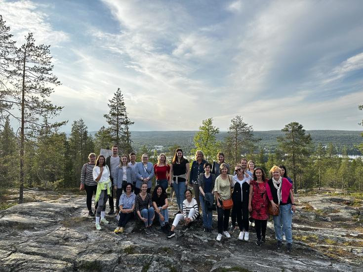 DEBUTING project team admiring the midnight sun in Rovaniemi, Lapland. DEBUTING project group at Ounasvaara hill, Rovaniemi, Lapland. With midnight sun in the back.