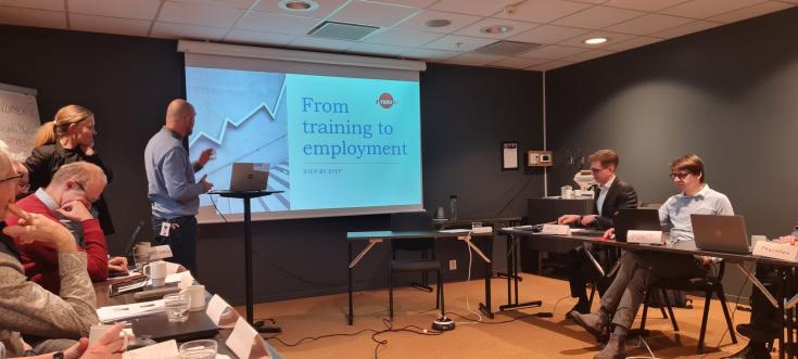 Participants listen to a male speaker, representing during the Peer Review in Kristiansand. 