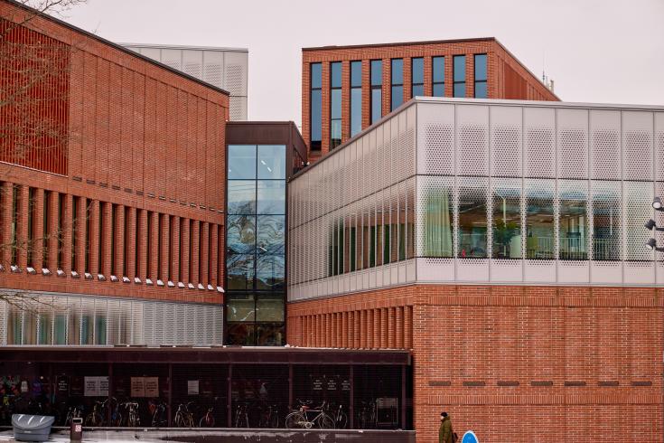 Building made of red bricks and glass Building made of red bricks and glass