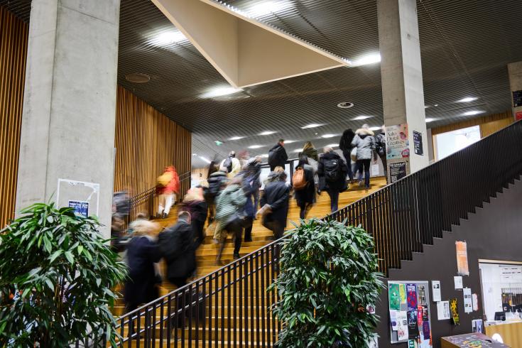 People walking up some stairs