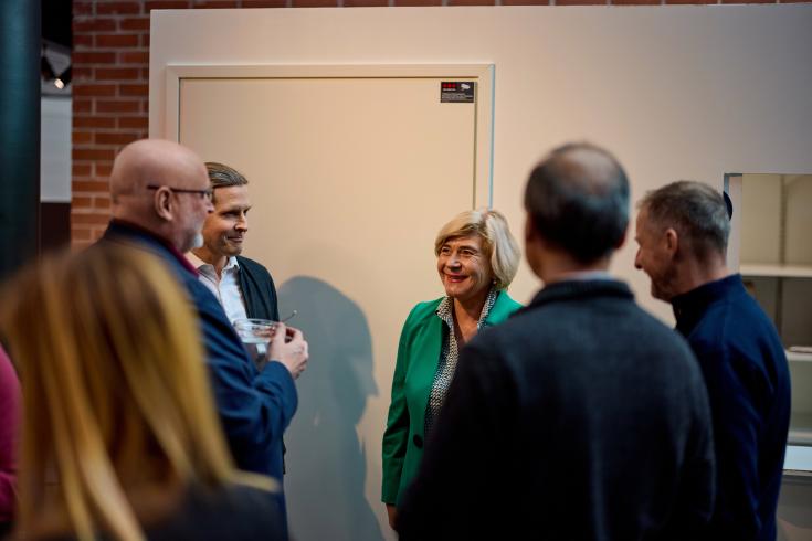 Group of people standing and talking