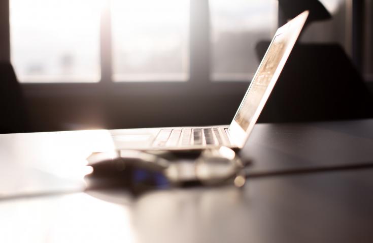 Laptop and mouse on desk