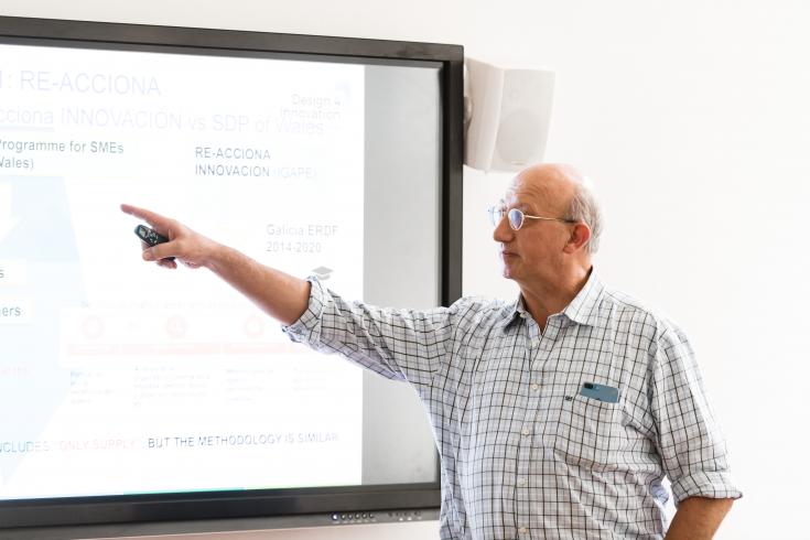 Man showing something on digital board Man showing something on digital board