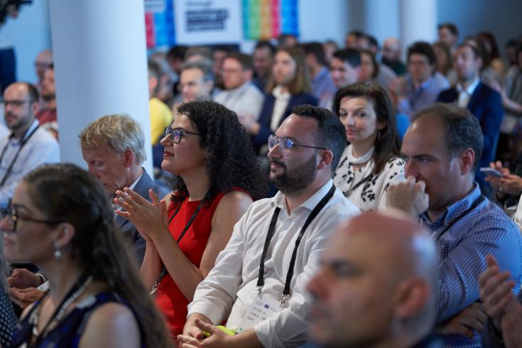 People in audience at event People in audience at event