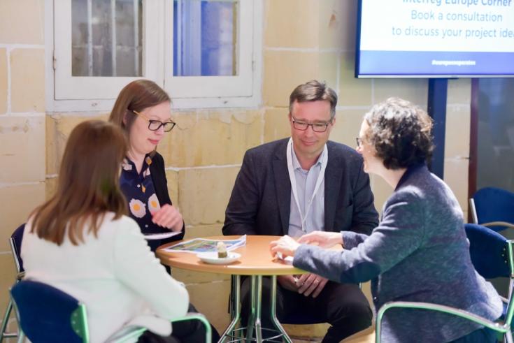 People network around a table at Project partner event - 2017