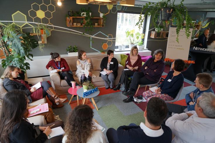 People sitting in circle at event