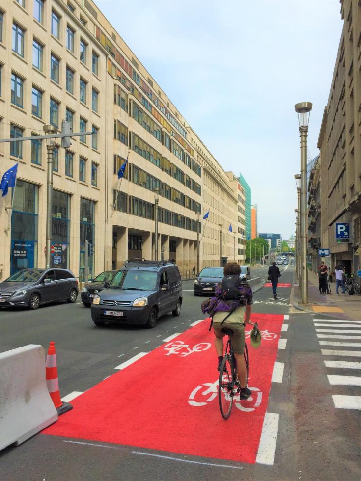 Person biking on biking lane in Brussels