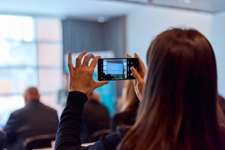 Person making photo during event Person making photo during event