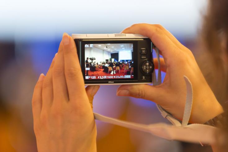 Person taking photo during event