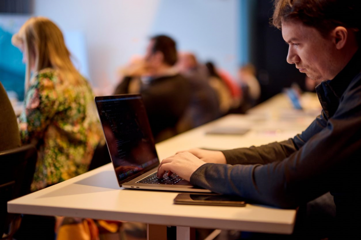 Person typing on a laptop Person typing on a laptop