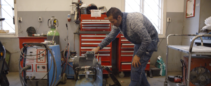 Person working in workshop Person working in workshop