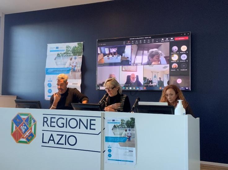 People sitting at the presentation table.