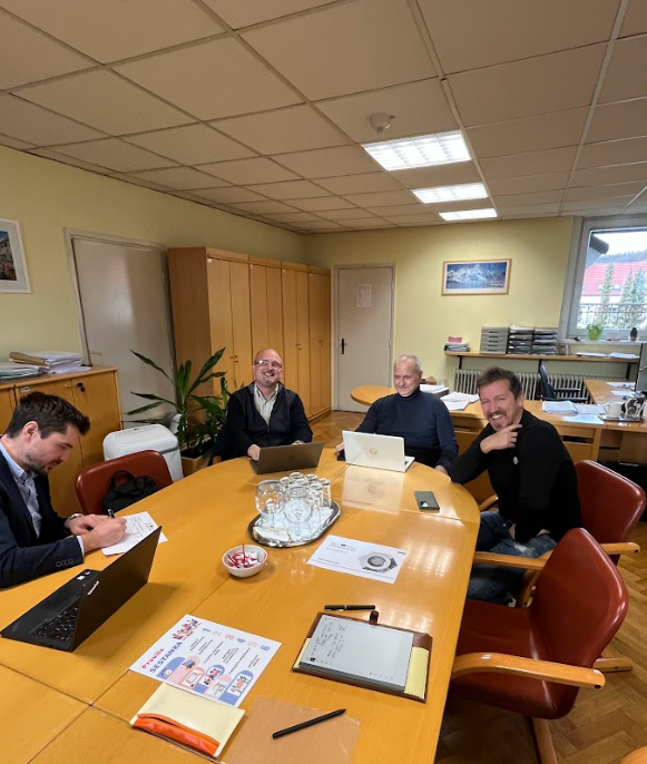 Participants of the 5th stakeholder seminar of ORZ pictured sitting around a table at the premises of the Maribor Municipality