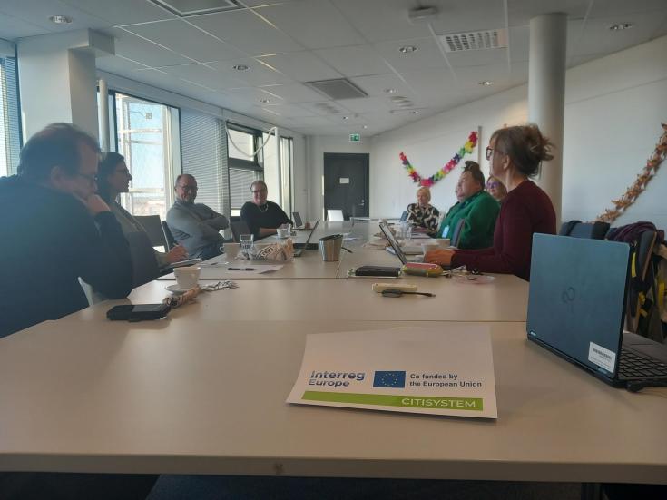 stakeholders sitting around the table
