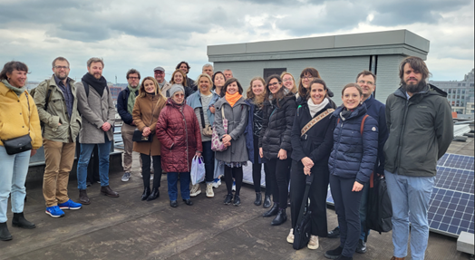 People gatherend on a roof during a study visit