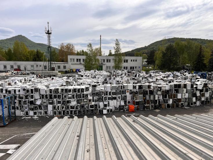 Washing machines stacked in rows at Praktik System Ltd.