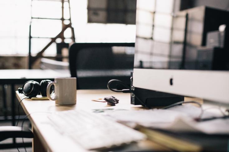 Desk with a computer and a mug 