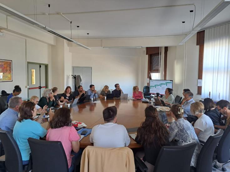 SALAM in tuscany People sit in a room around a large table