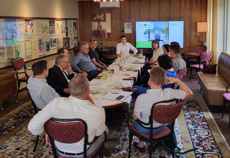 People around a meeting table having a conference