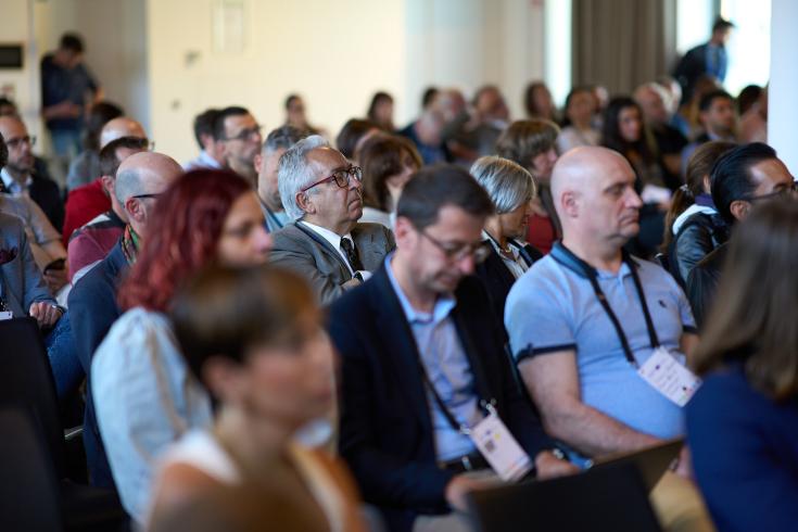 People sitting at a conference People sitting at a conference
