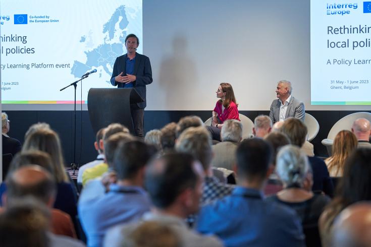 People on stage giving a presentation