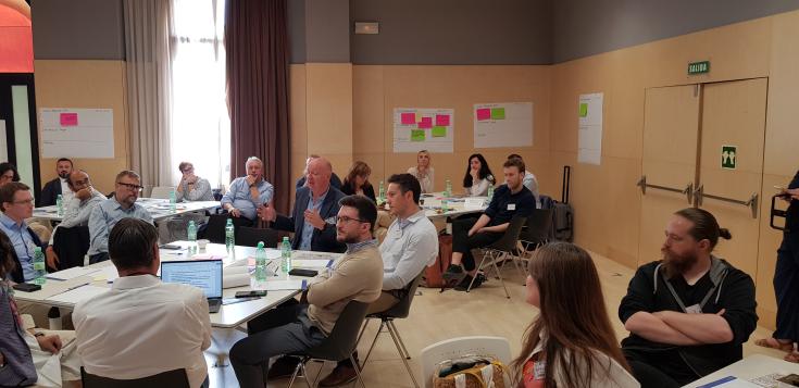 The workshop took place in Burgos, Spain. People sitting at the workshop.