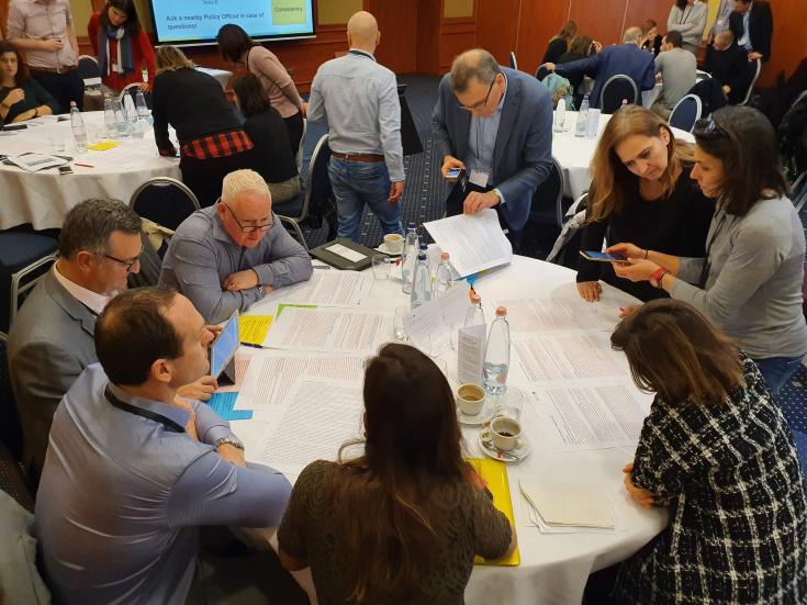 project training in progress group of people around a table working together on an exercise