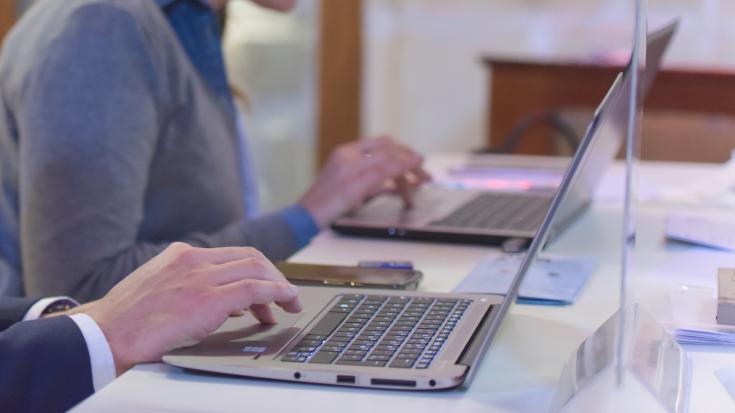 People typing on laptops People typing on laptops