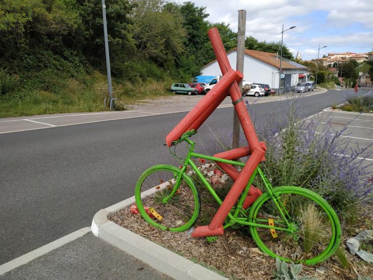 Parked bicycle next to a road 